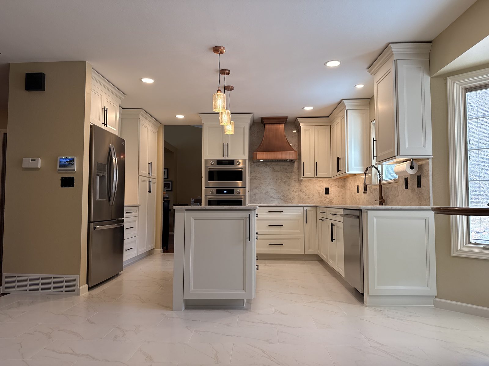 Full kitchen remodel with recessed and pendant lighting