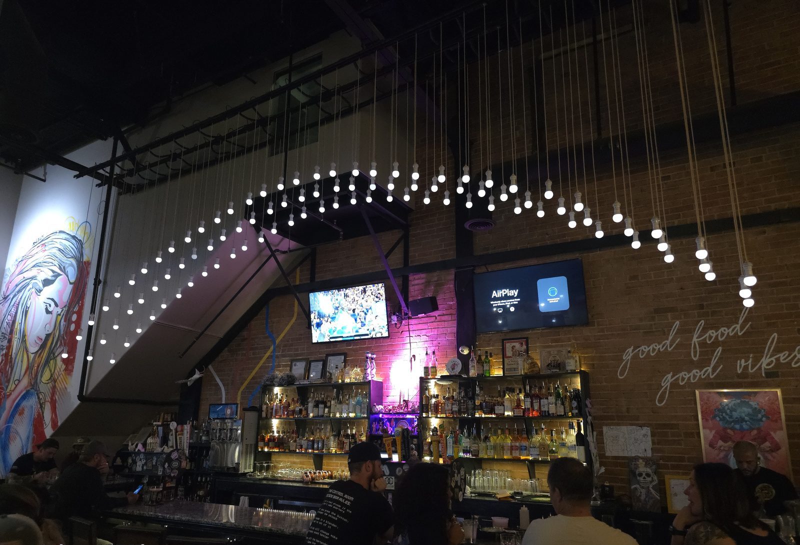 Custom hanging bulb lighting installation over the bar at Streetcar 520